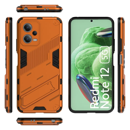 For Xiaomi Redmi Note 12 China / Note 12 5G India Punk Armor 2 in 1 PC + TPU Phone Case with Invisible Holder(Orange) by buy2fix
