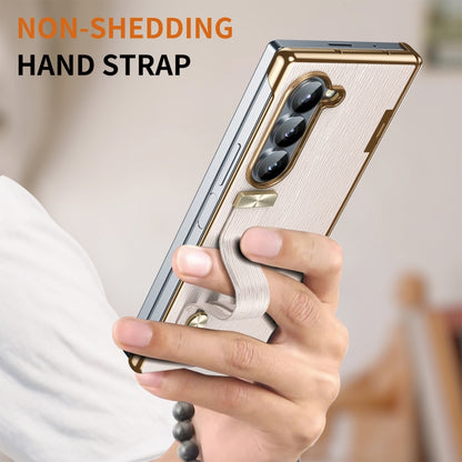 For Samsung Galaxy Z Fold5 Retractable Wrist Strap Invisible Stand Phone Case(Pink) - Galaxy Z Fold5 Cases by buy2fix | Online Shopping UK | buy2fix