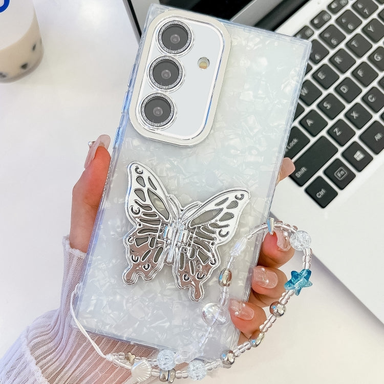 For Samsung Galaxy S25+ 5G Plating Glitter Lens Film Texture Butterfly Holder Wristband Phone Case(White Shell Pattern) by buy2fix